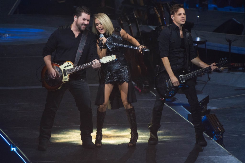 Ed Eason (right) performing with Carrie Underwood during the Storyteller Tour (Photo source: Dan Harper)